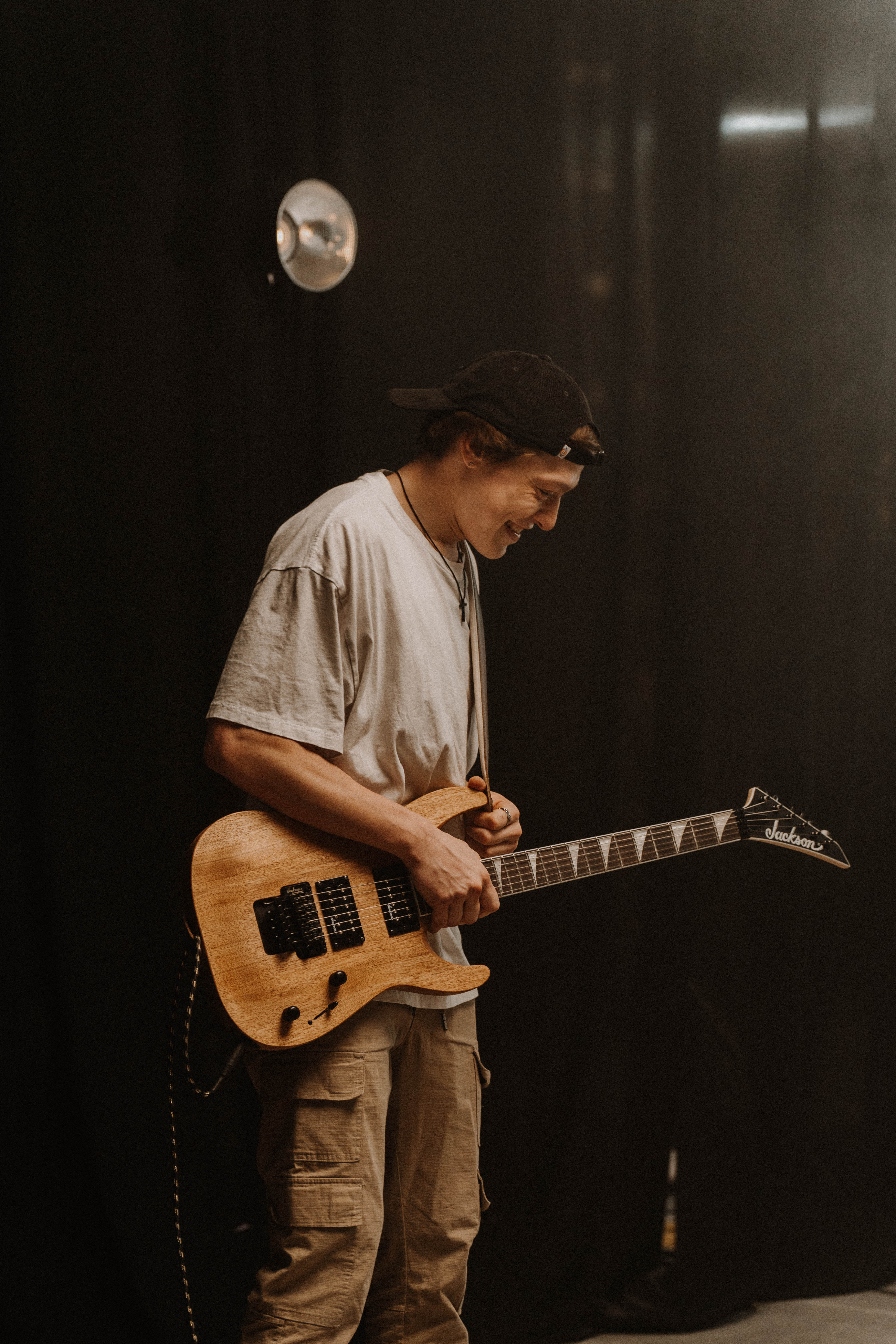 roo playing guitar onstage for the lost & found release highlight